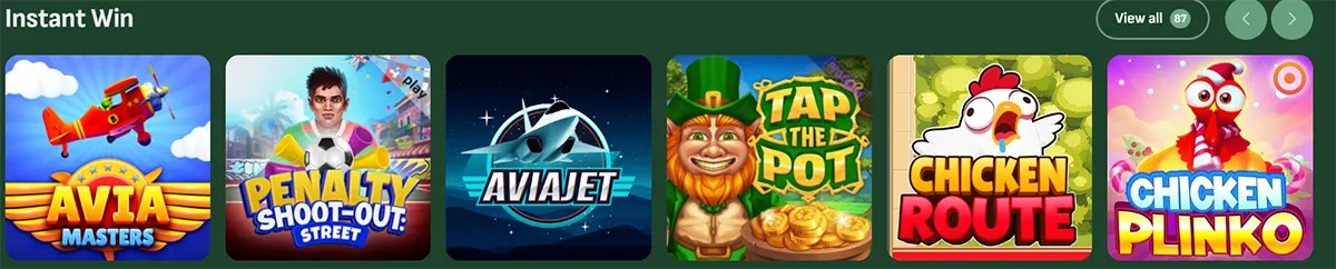 Instant win games section displaying colorful game tiles including Avia Masters, Penalty Shoot-Out Street, AviaJet, Tap the Pot, Chicken Route, and Chicken Plinko, with a “View all” option on a green casino interface.