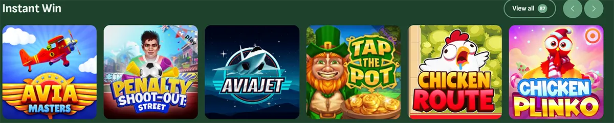 Instant win games section displaying colorful game tiles including Avia Masters, Penalty Shoot-Out Street, AviaJet, Tap the Pot, Chicken Route, and Chicken Plinko, with a “View all” option on a green casino interface.
